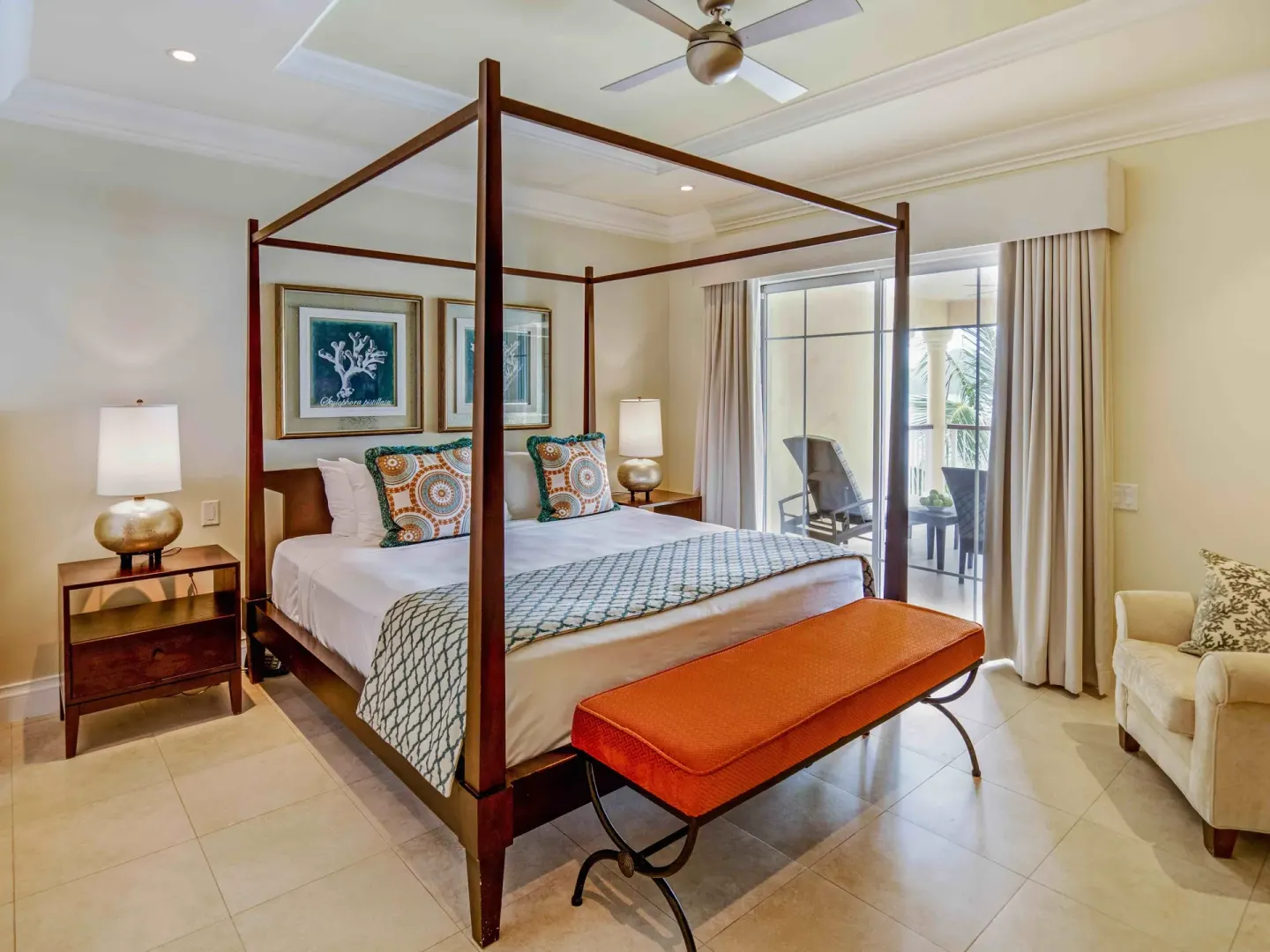 Four-poster king bedroom in a villa suite at The Landings Resort & Spa with balcony doors.