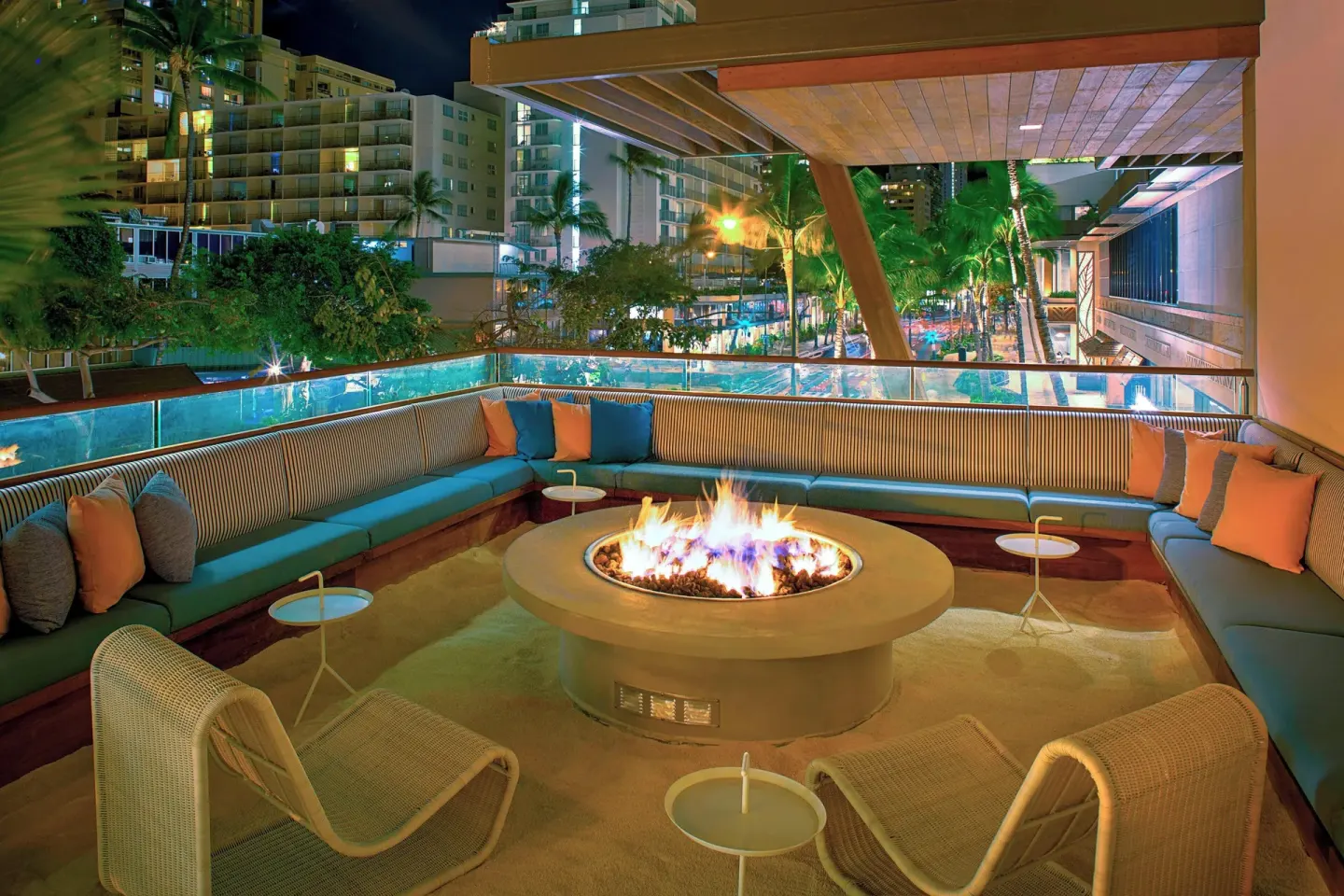 Nighttime fire pit lounge at The Laylow Waikiki, Autograph Collection.