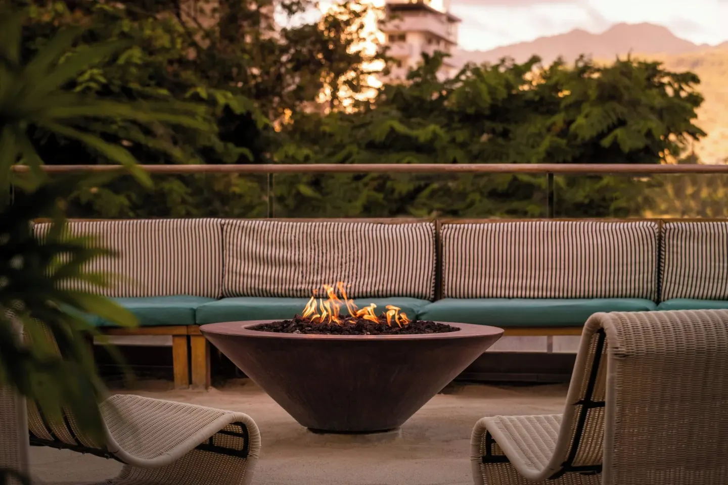 Outdoor fire pit lounge at The Laylow Waikiki, Autograph Collection.