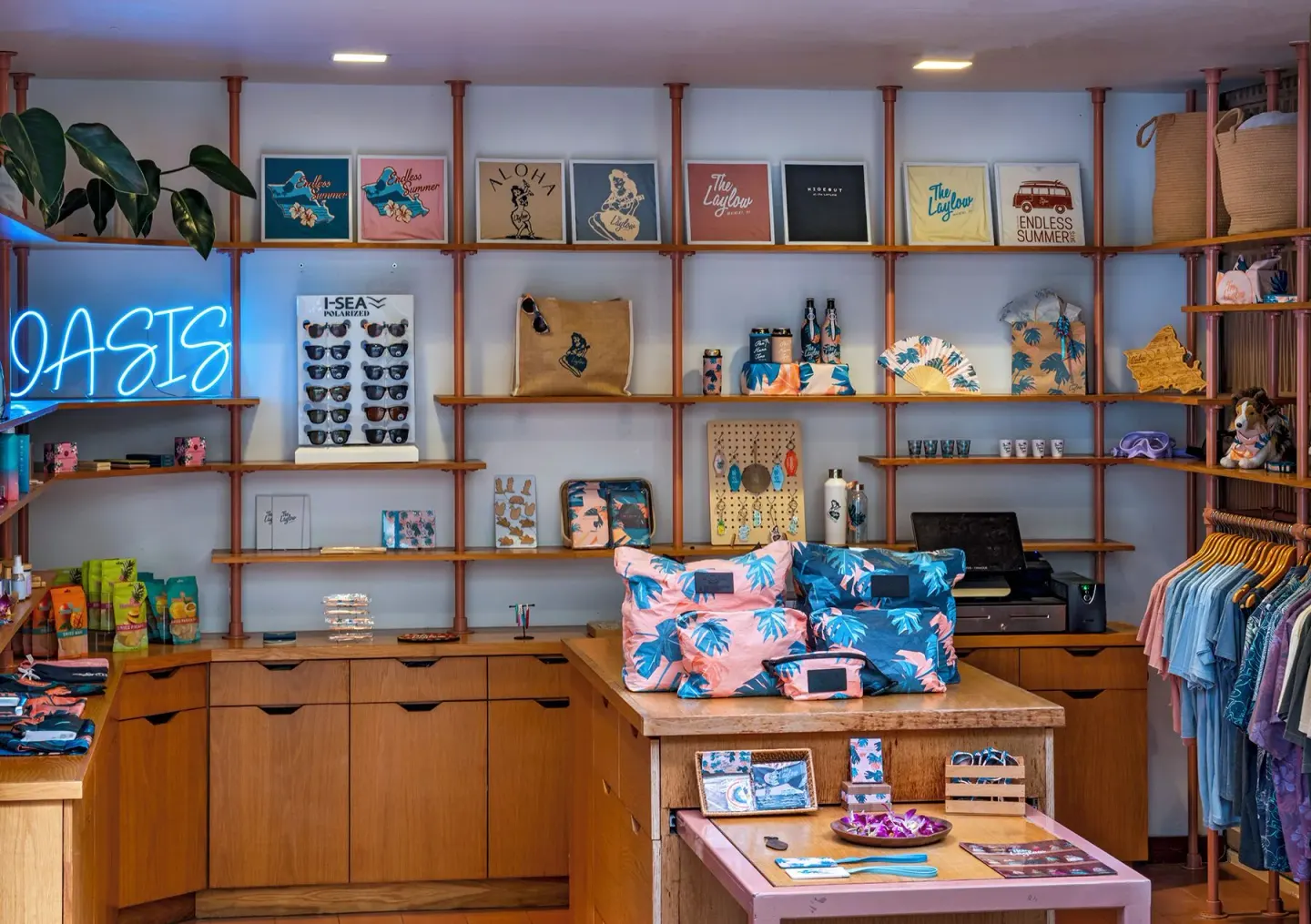 Resort shop display with shelves and neon sign at The Laylow Waikiki, Autograph Collection.