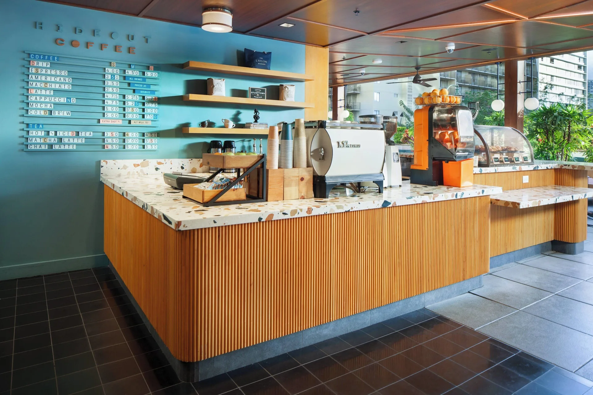 Hideout Coffee counter and menu board at The Laylow Waikiki, Autograph Collection.