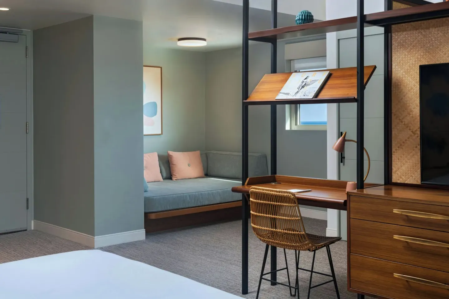 Corner Suite work desk and daybed nook at The Laylow Waikiki, Autograph Collection.