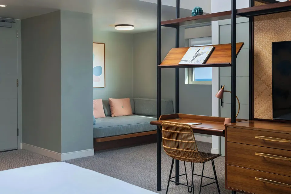 Corner Suite work desk and daybed nook at The Laylow Waikiki, Autograph Collection.