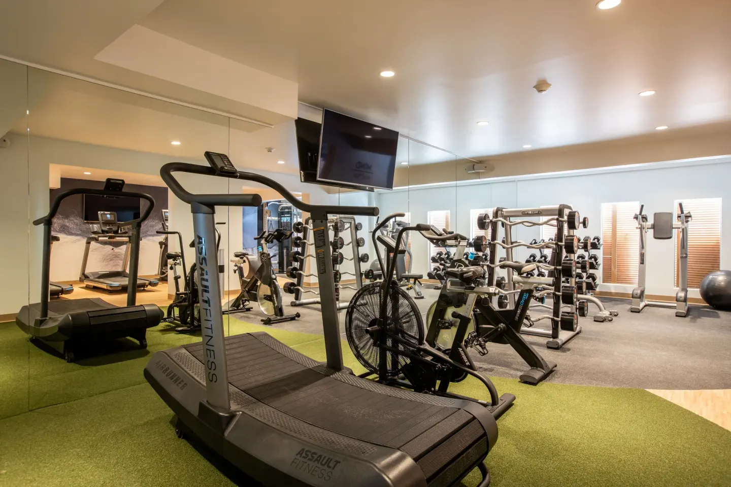Fitness center with treadmills, bikes and weights at The Morgan Resort Spa Village.