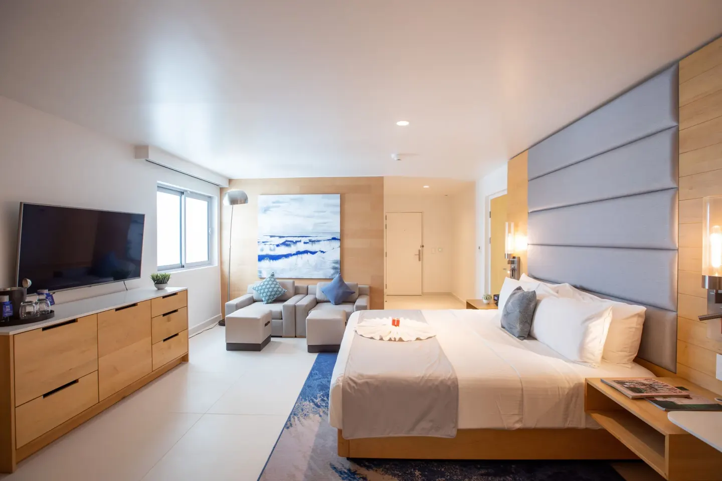 Accessible guestroom with king bed and seating area at The Morgan Resort Spa Village.