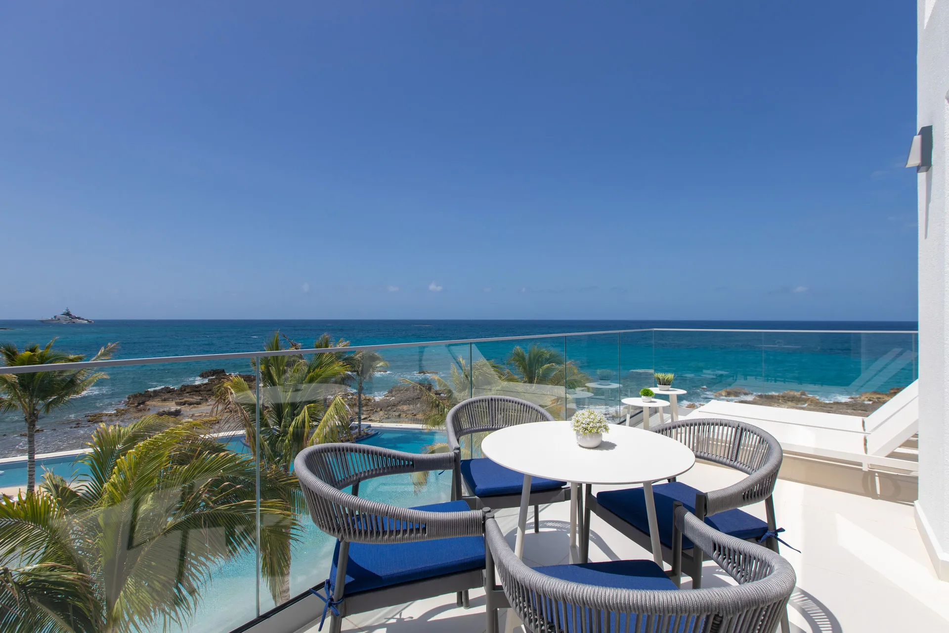 Junior Oceanfront Suite balcony with ocean views at The Morgan Resort Spa Village.