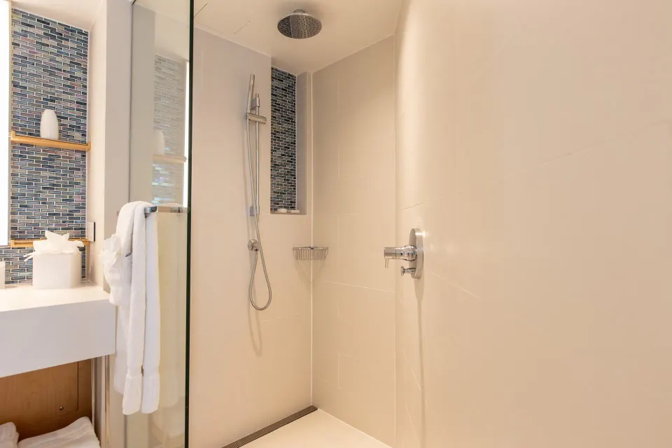 Junior Oceanfront Suite walk-in shower with rain head at The Morgan Resort Spa Village.