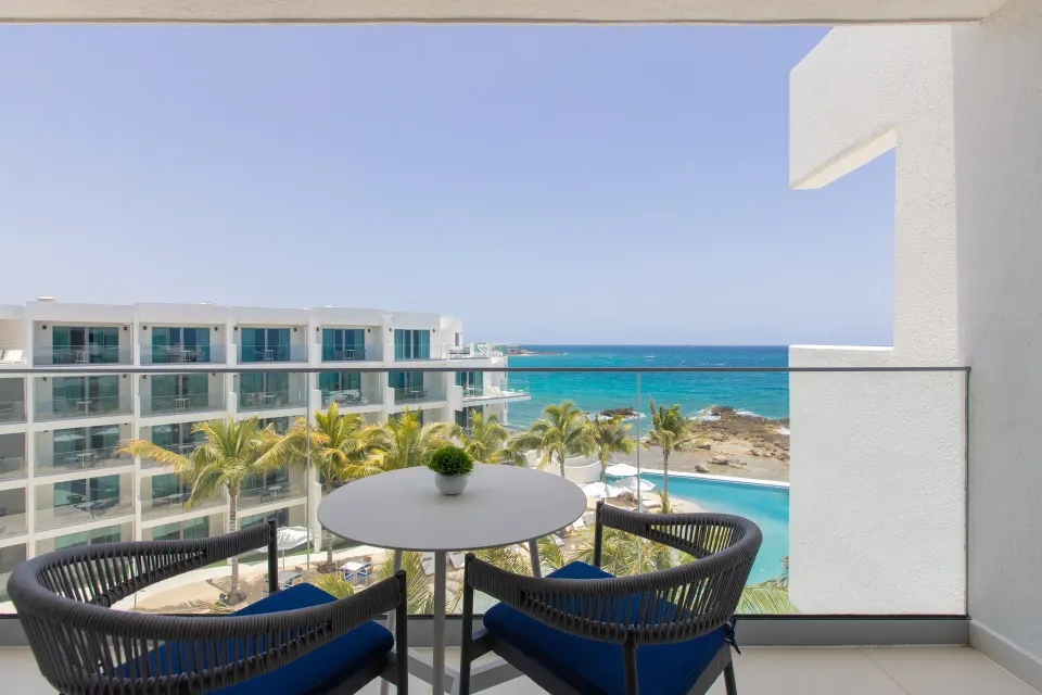 Oceanview Guestroom balcony with ocean and pool view at The Morgan Resort Spa Village.