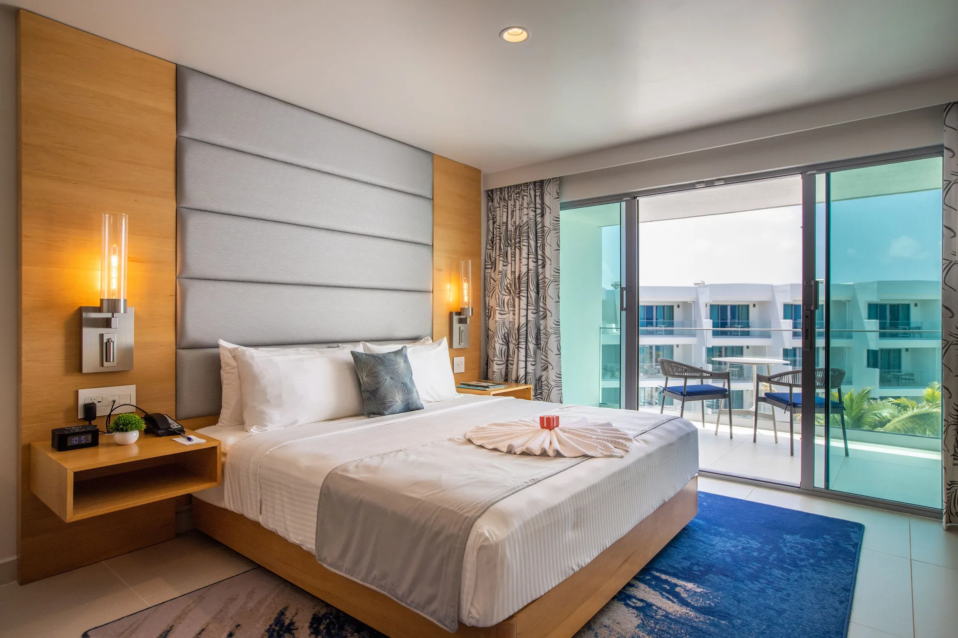 Oceanview Guestroom king bed with balcony at The Morgan Resort Spa Village.