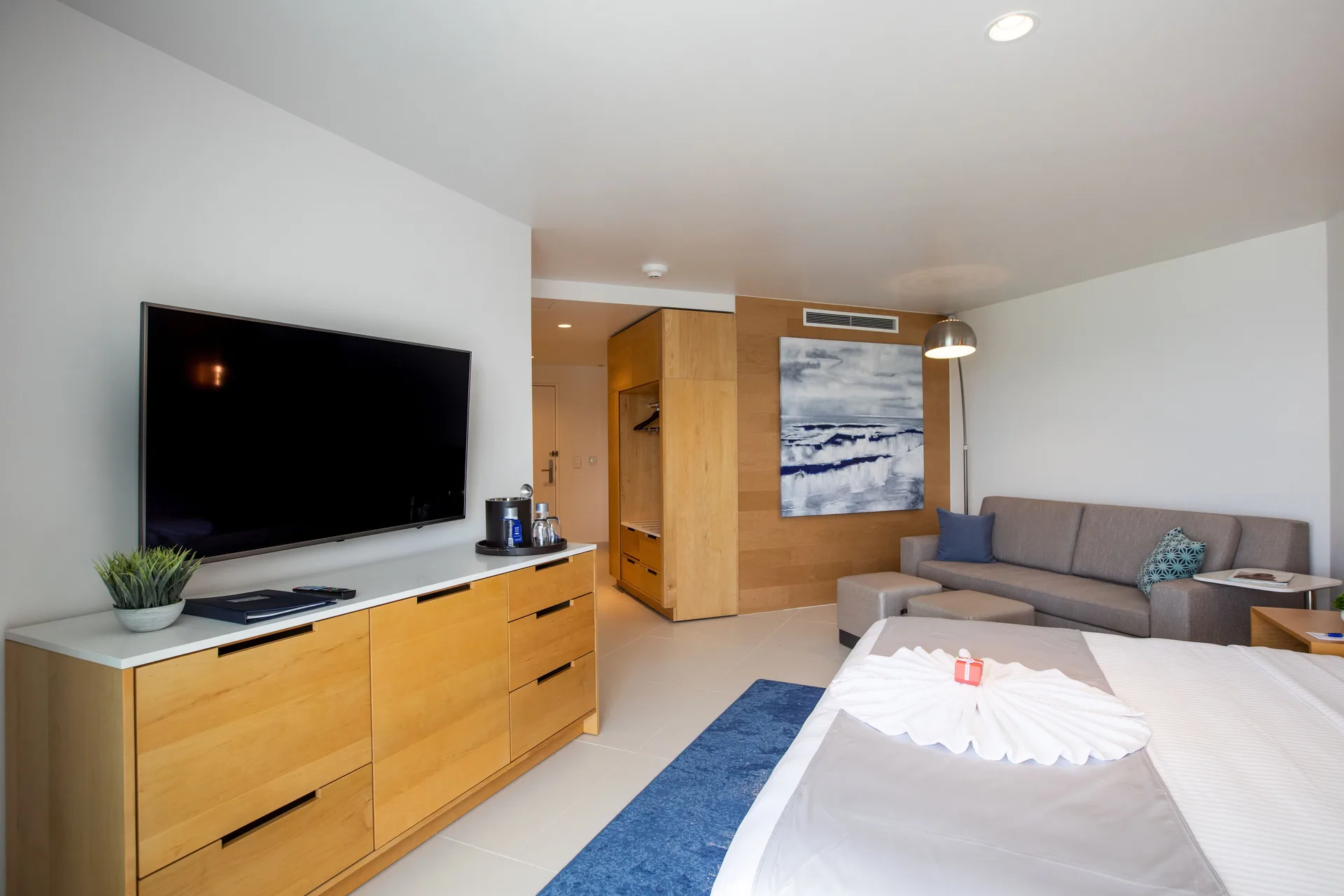 Oceanview Guestroom seating area and TV at The Morgan Resort Spa Village.