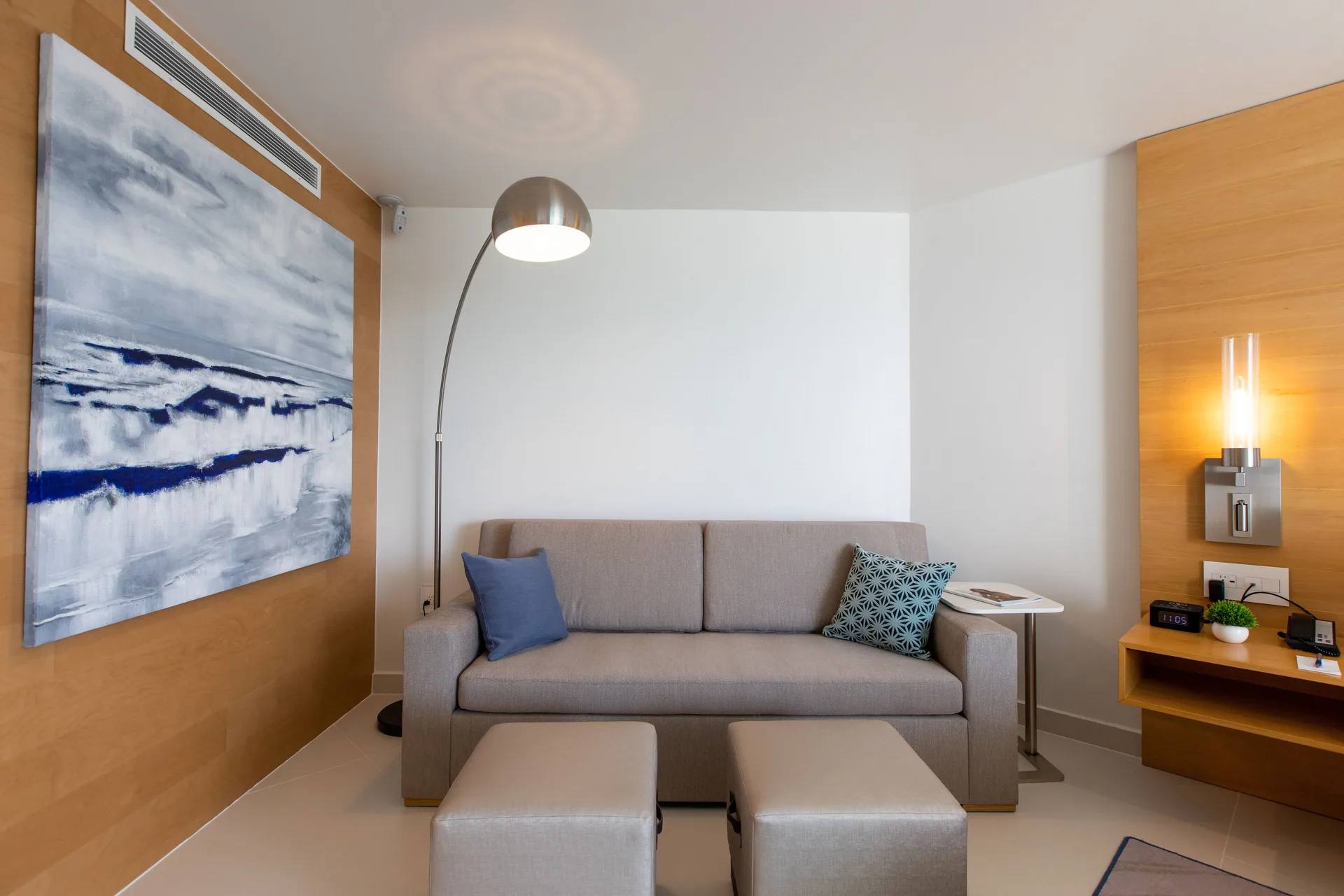 Oceanview Guestroom sofa with ottomans at The Morgan Resort Spa Village.