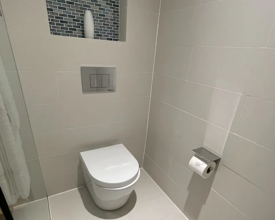 Toilet area in a Runway View Guestroom bathroom at The Morgan Resort Spa Village.