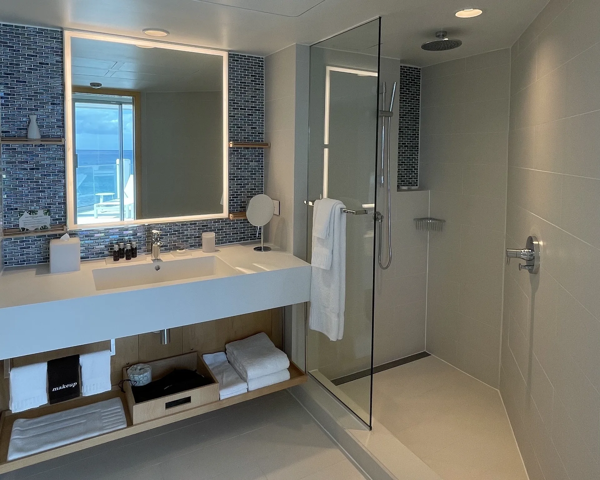 Runway View Guestroom walk-in shower bathroom at The Morgan Resort Spa Village.