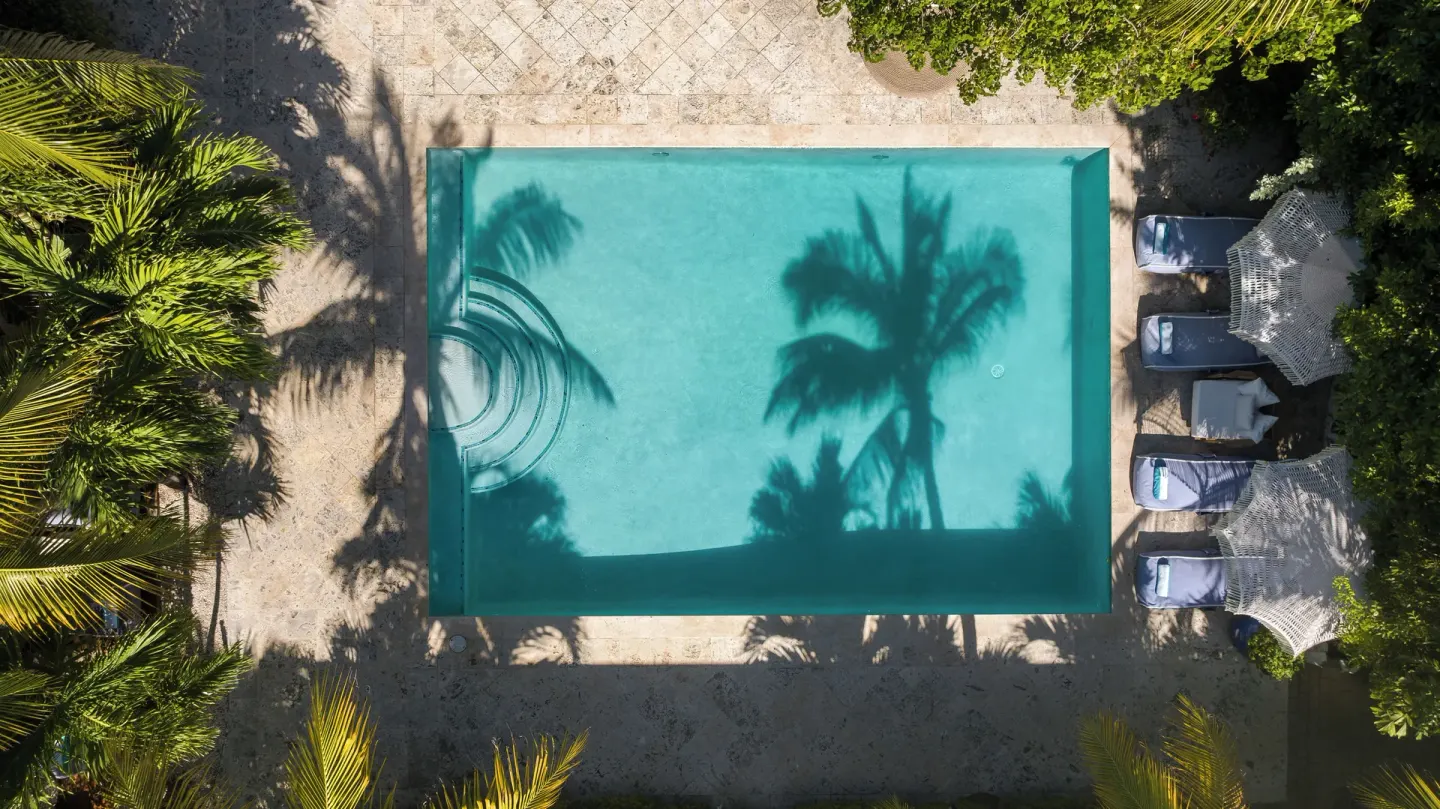 Overhead view of the pool and loungers at The Oasis at Grace Bay.