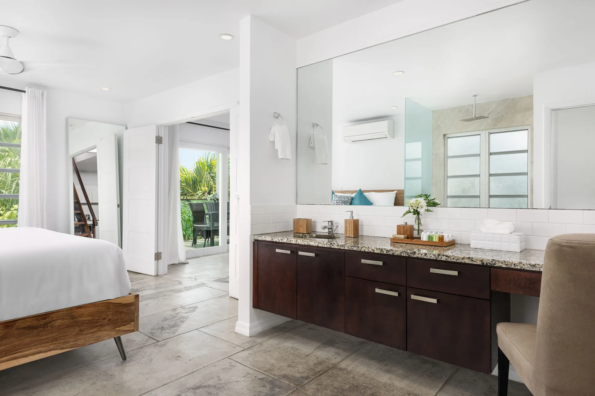 Second Level Pool Suite bedroom and vanity area at The Oasis at Grace Bay.