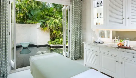 Spa treatment room opening to a private plunge pool at The Palms Turks and Caicos.