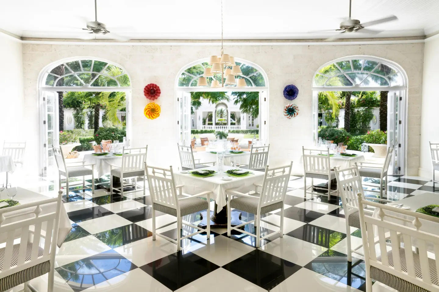 Bright dining room with checkerboard floor at The Palms Turks and Caicos.