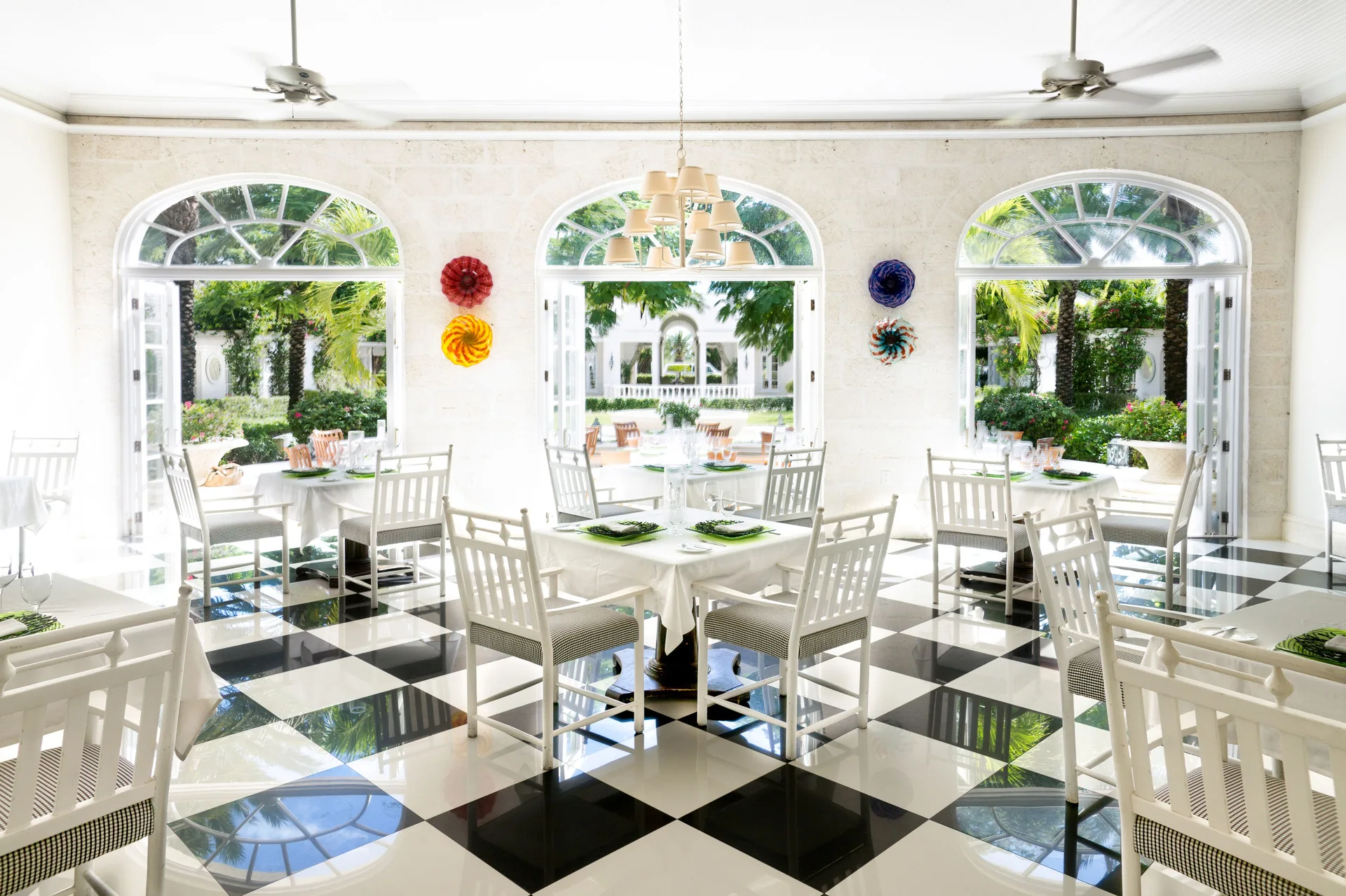 Bright dining room with checkerboard floor at The Palms Turks and Caicos.