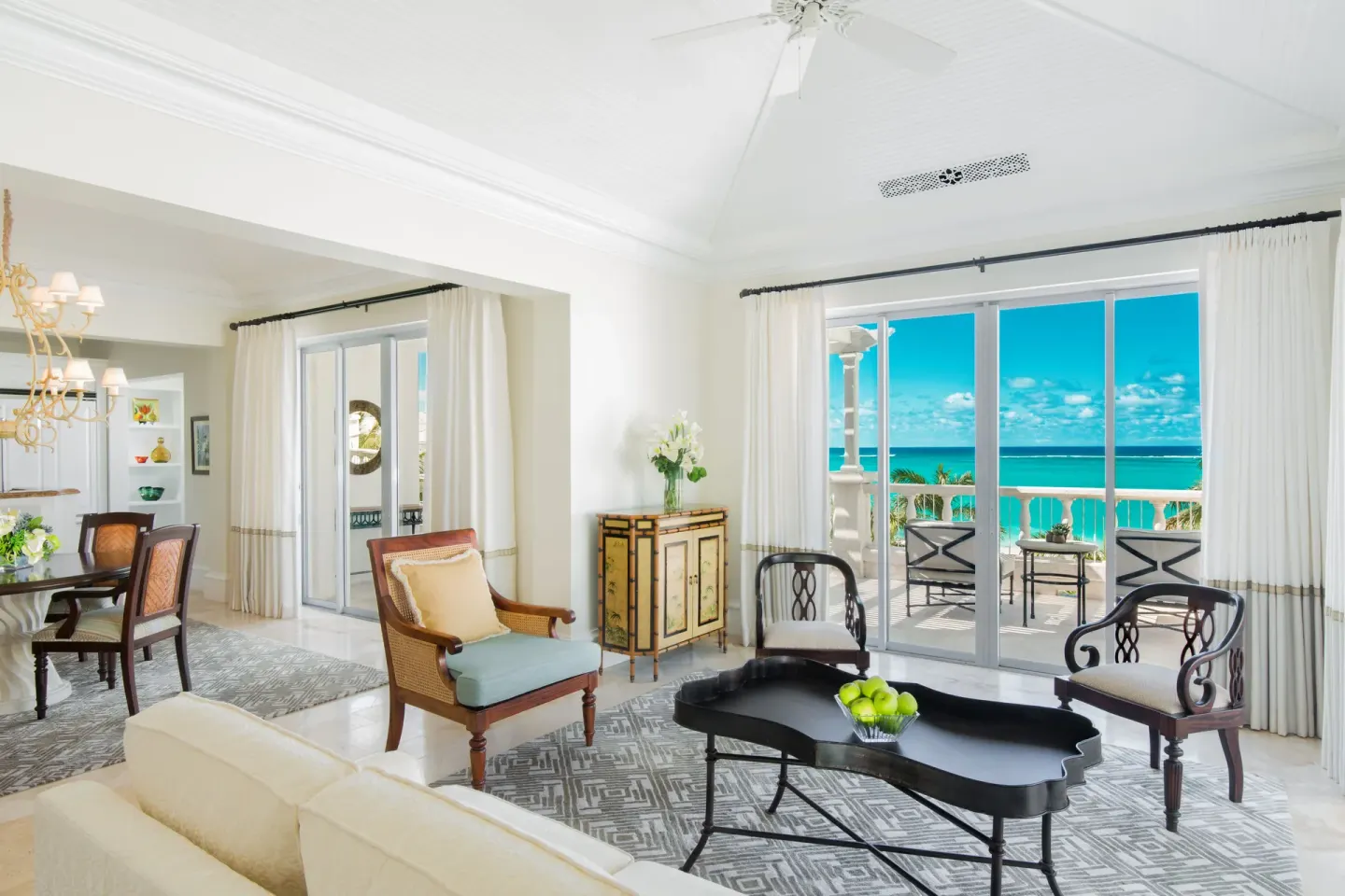 Oceanfront one-bedroom suite living room and balcony at The Palms Turks and Caicos.