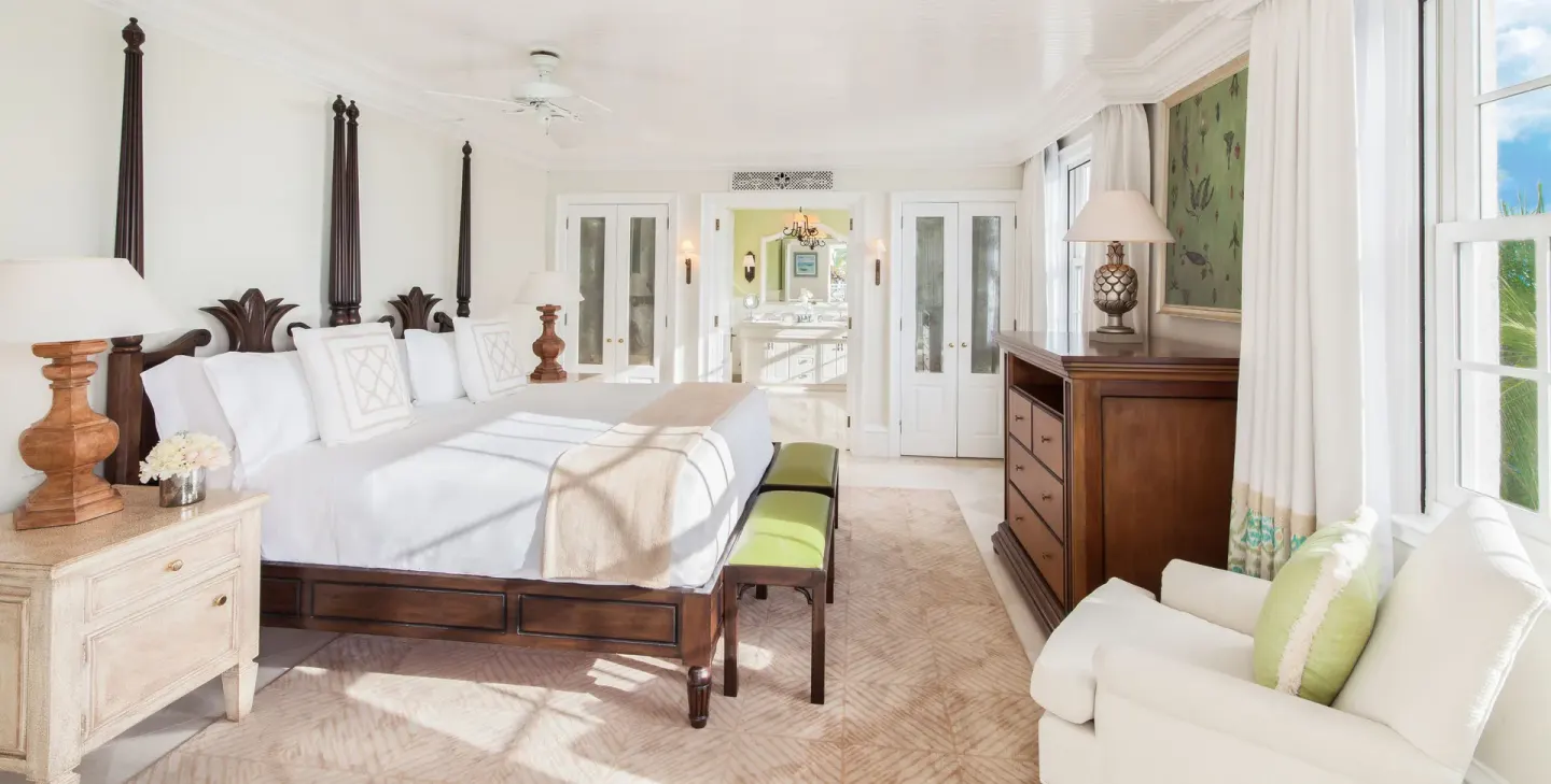 Bright king bedroom in a one-bedroom pool view suite at The Palms Turks and Caicos.