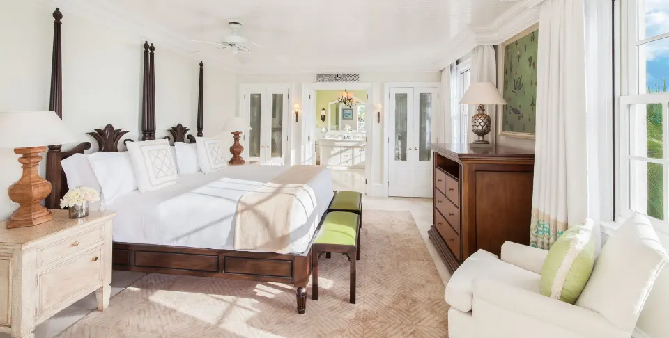 Bright king bedroom in a one-bedroom pool view suite at The Palms Turks and Caicos.