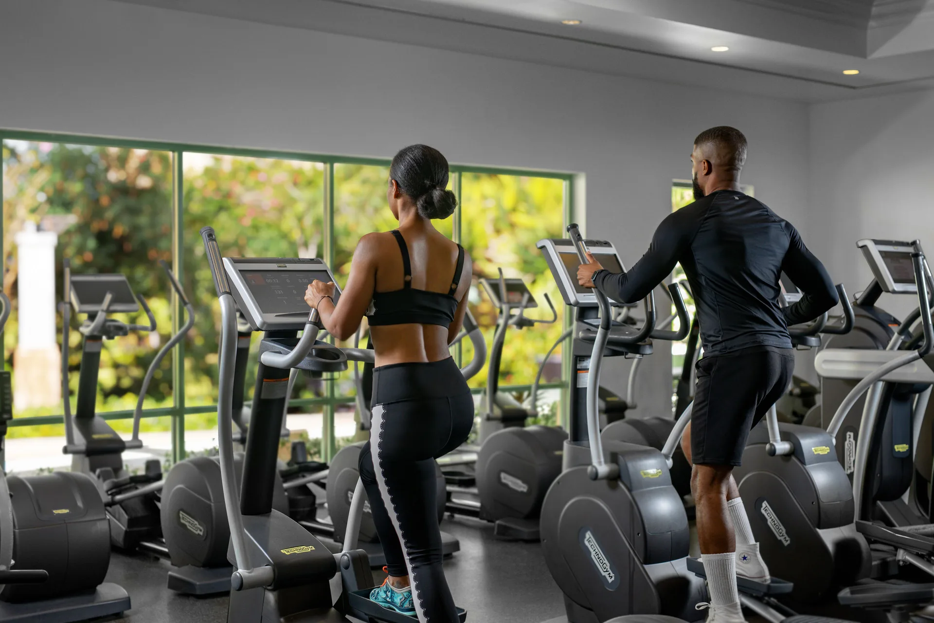 Guests using elliptical machines in the fitness center at The Reef at Atlantis.
