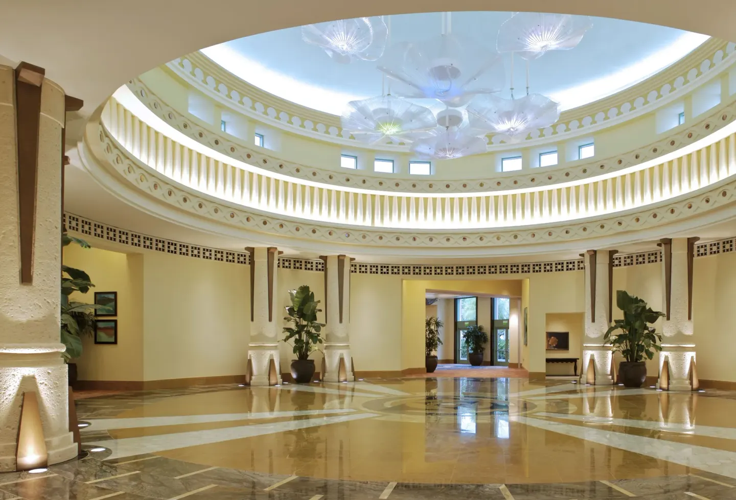 Circular lobby rotunda with glossy floors and ceiling lights at The Reef at Atlantis.