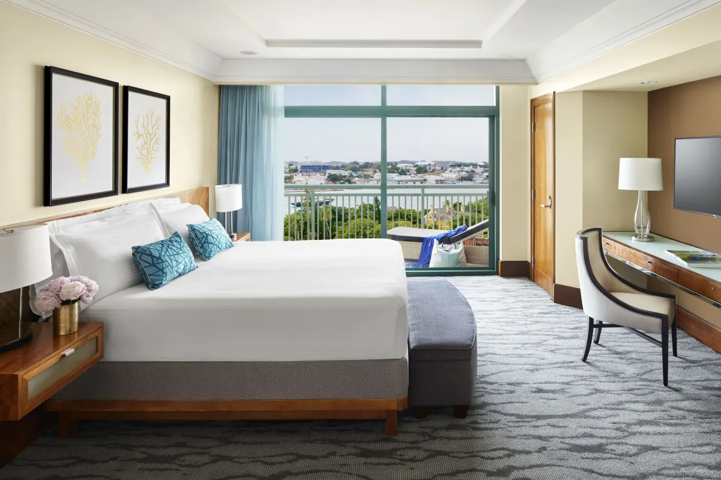 One Bedroom Harbor Suite king bedroom with balcony at The Reef at Atlantis.