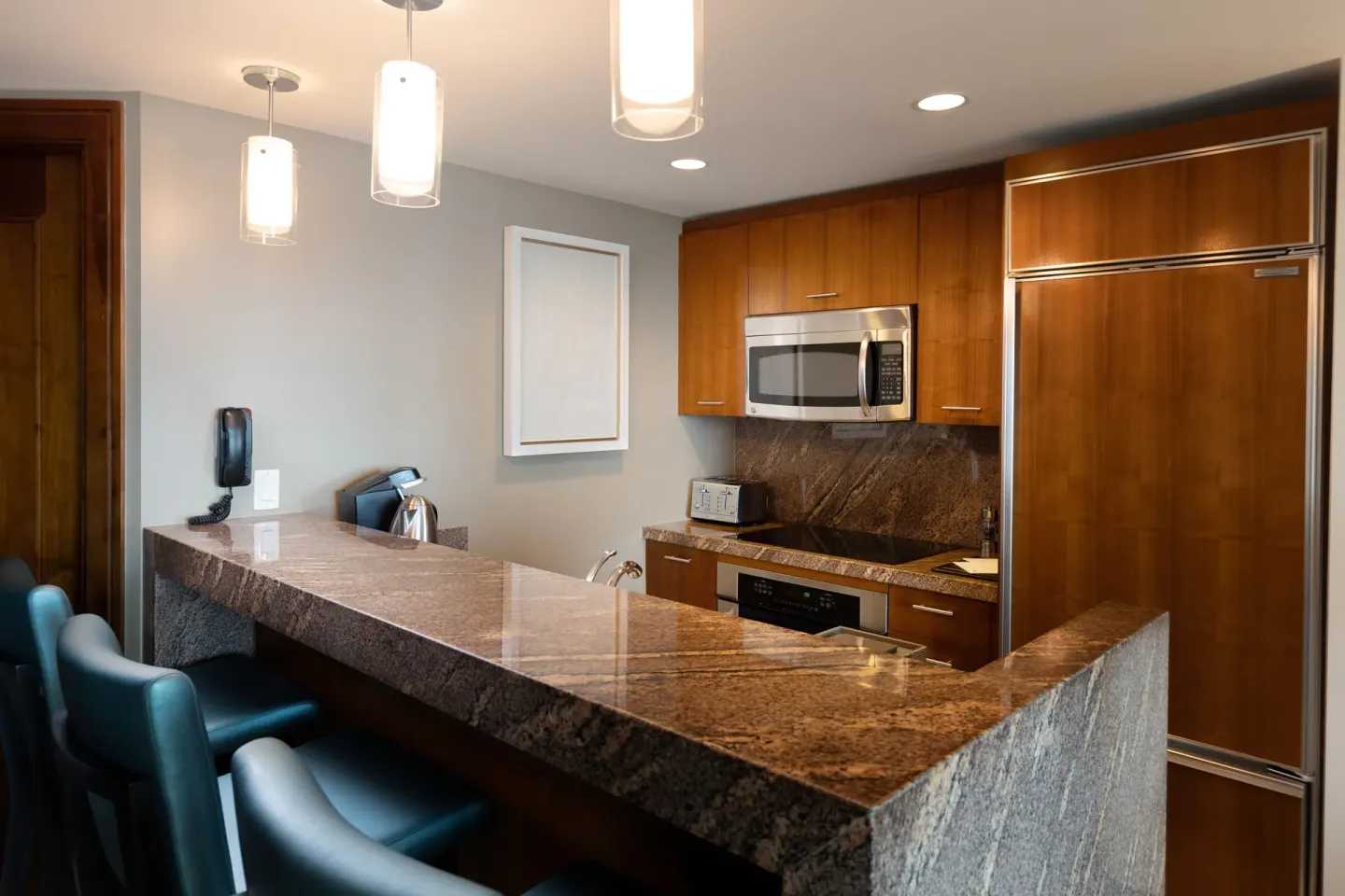 One Bedroom Terrace Suite kitchenette with granite bar at The Reef at Atlantis.