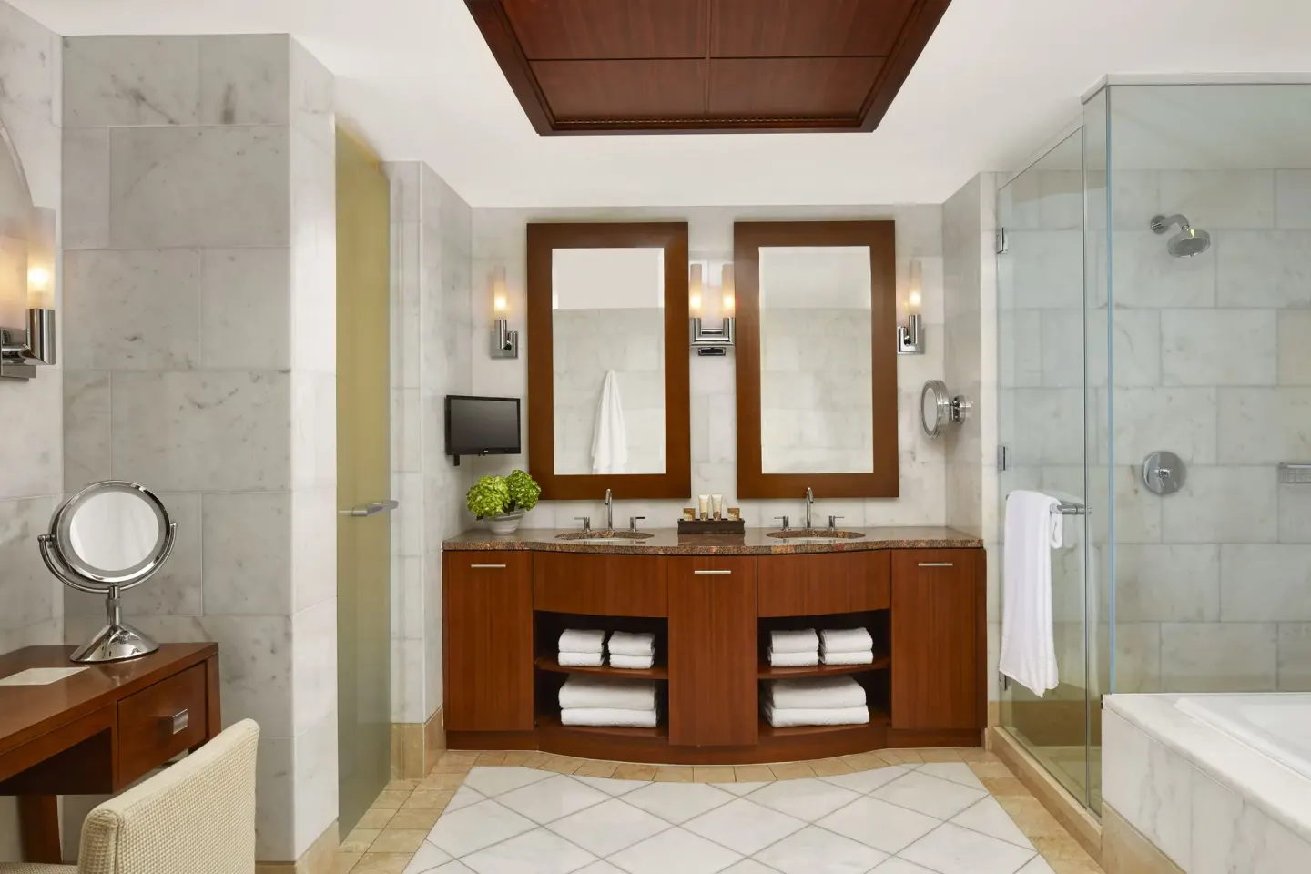 One Bedroom Topaz Suite bathroom with double vanity and glass shower at The Reef at Atlantis.
