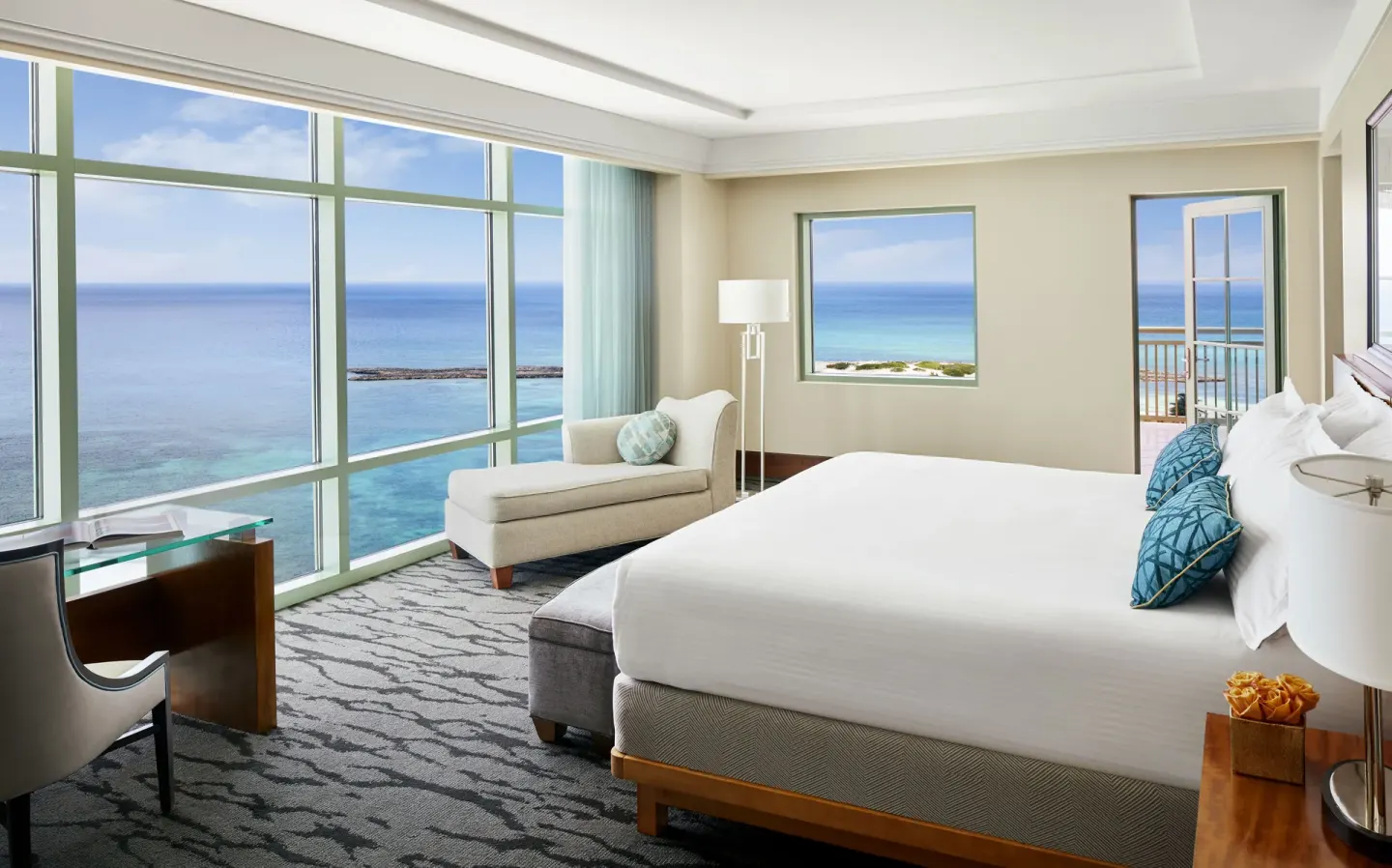 One Bedroom Topaz Suite bedroom with king bed and ocean views at The Reef at Atlantis.