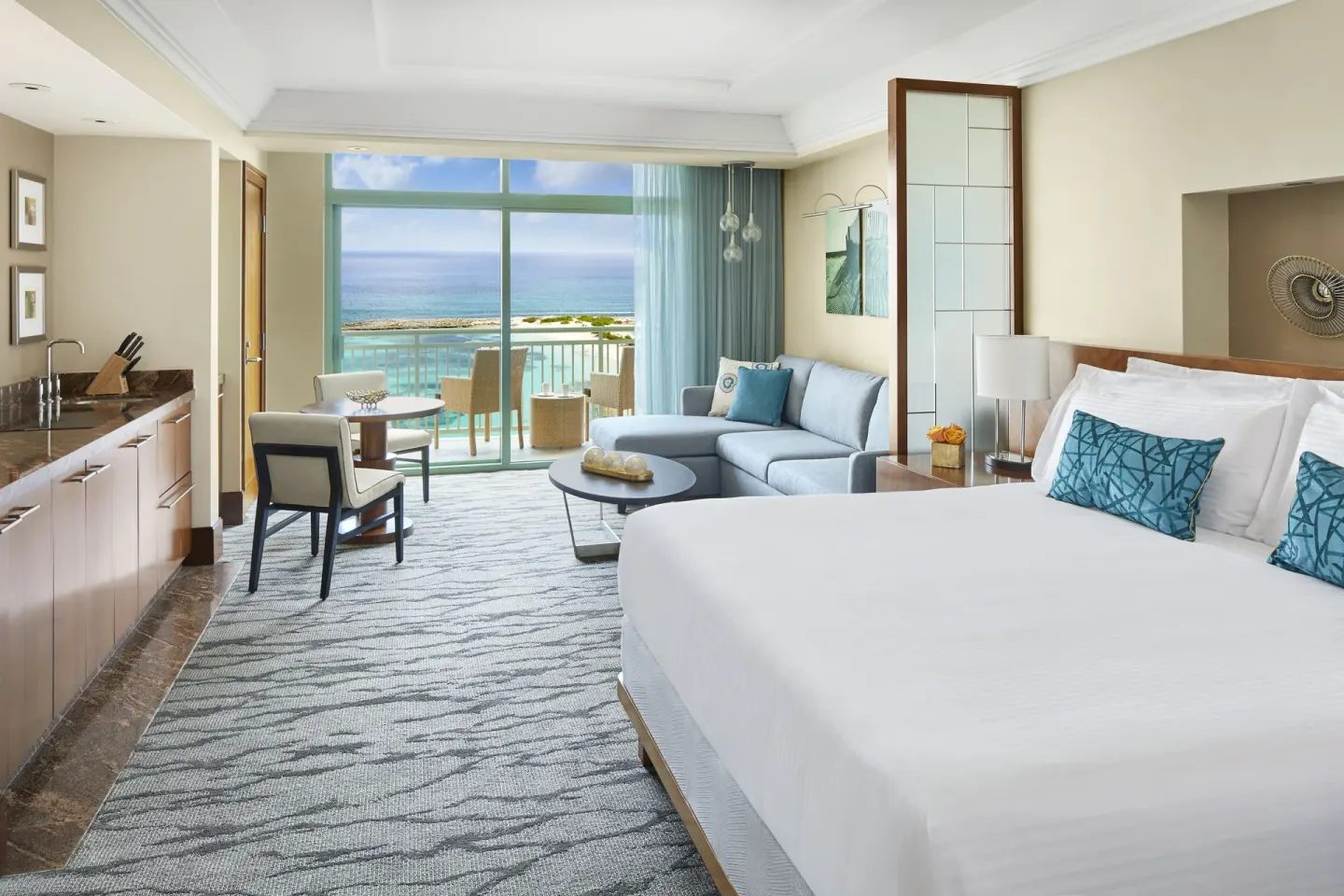 Studio Ocean View room with king bed, sofa, kitchenette and balcony at The Reef at Atlantis.