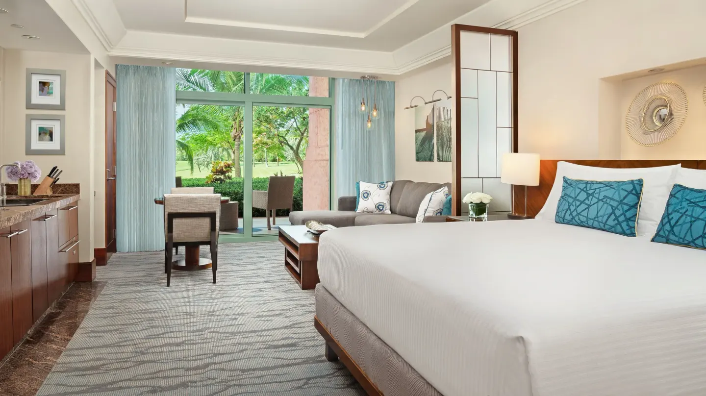 Studio Terrace View guest room with king bed and patio doors at The Reef at Atlantis.