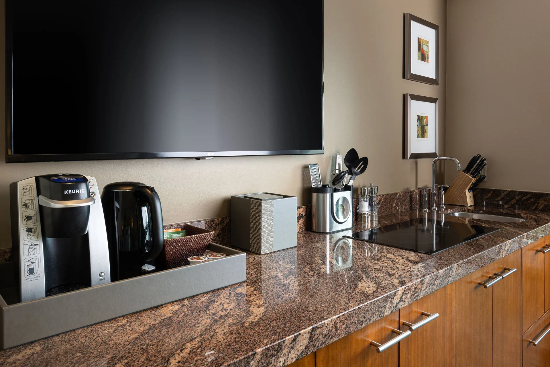 Studio Terrace View kitchenette counter with TV and sink at The Reef at Atlantis.