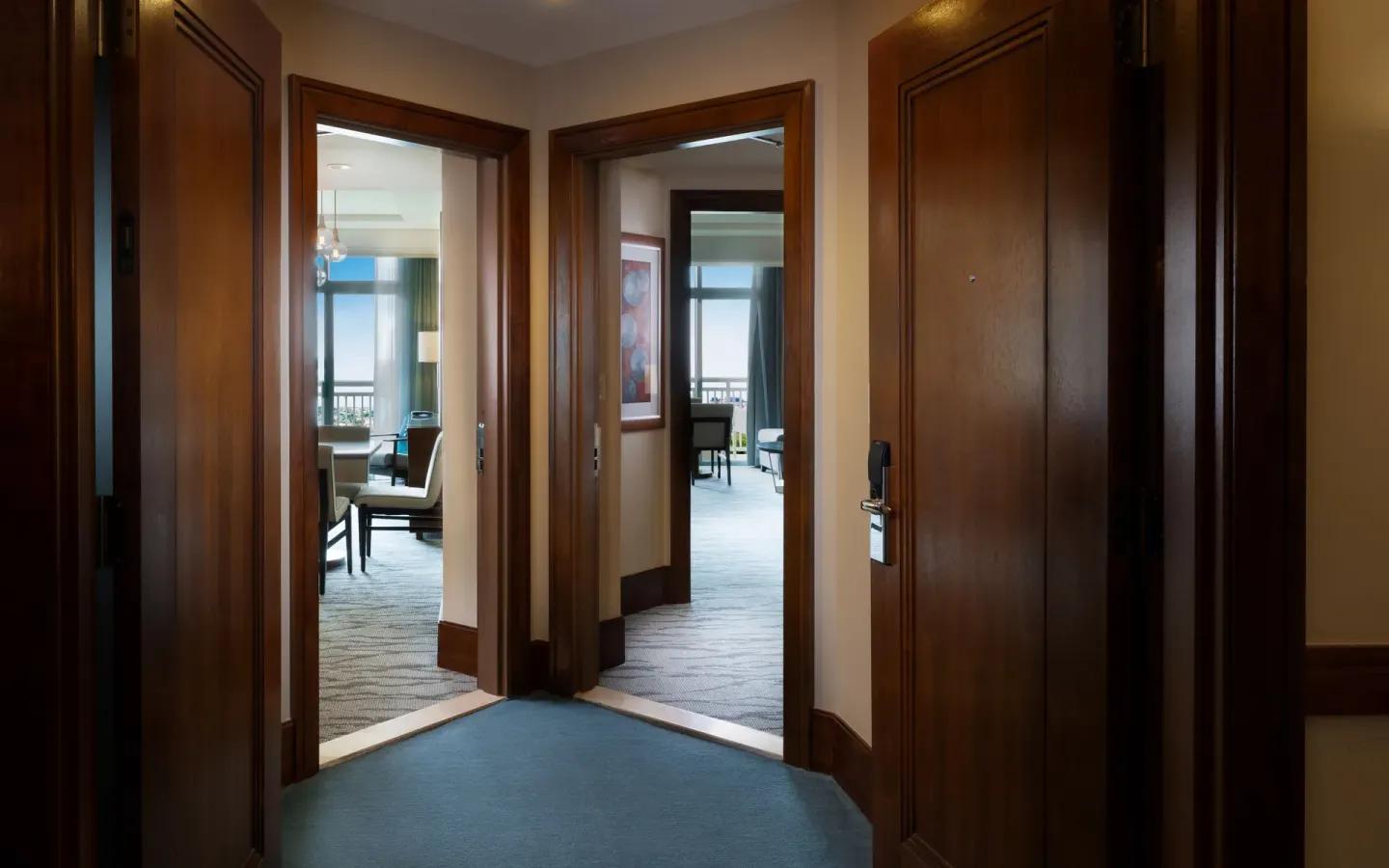 Entry hallway of a Two Bedroom Terrace Suite at The Reef at Atlantis with two open doorways.