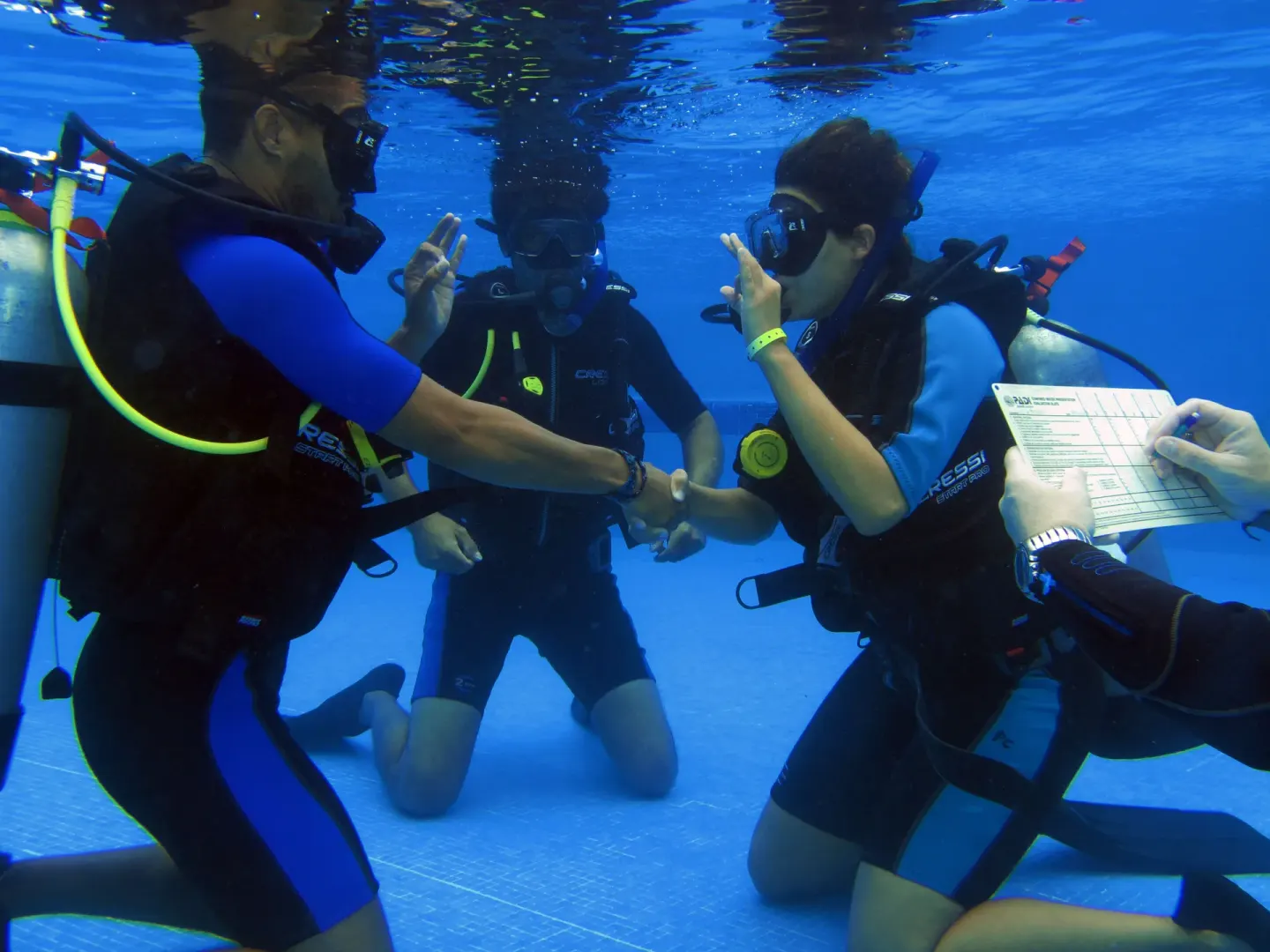 Scuba instruction underwater in a pool at The Reef Coco Beach Resort & Spa.
