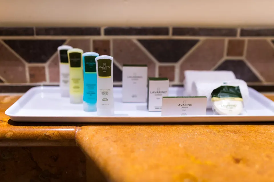 Bath amenities on a tray in a Premium Partial Ocean View Room at The Reef Coco Beach Resort & Spa.