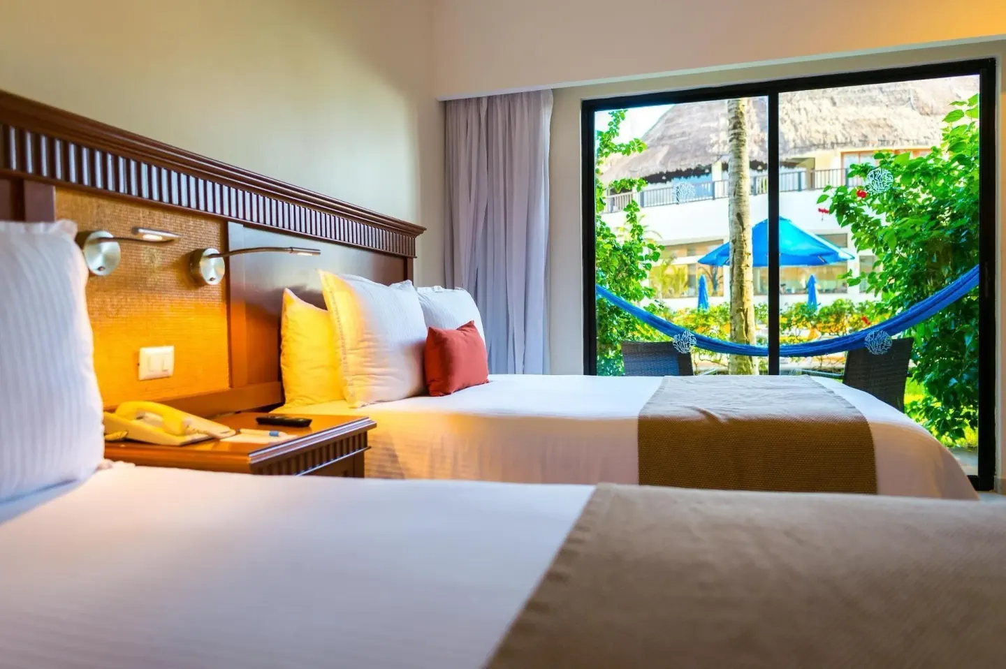 Superior Garden View Room with two beds and balcony at The Reef Coco Beach Resort & Spa.