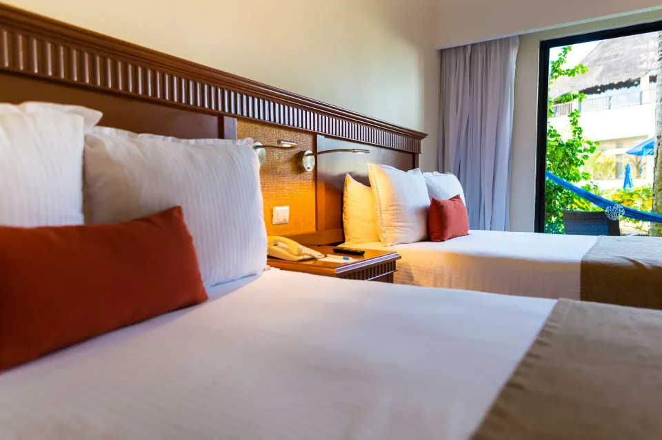 Superior Room Garden View two-bed room with balcony hammock at The Reef Coco Beach Resort & Spa.