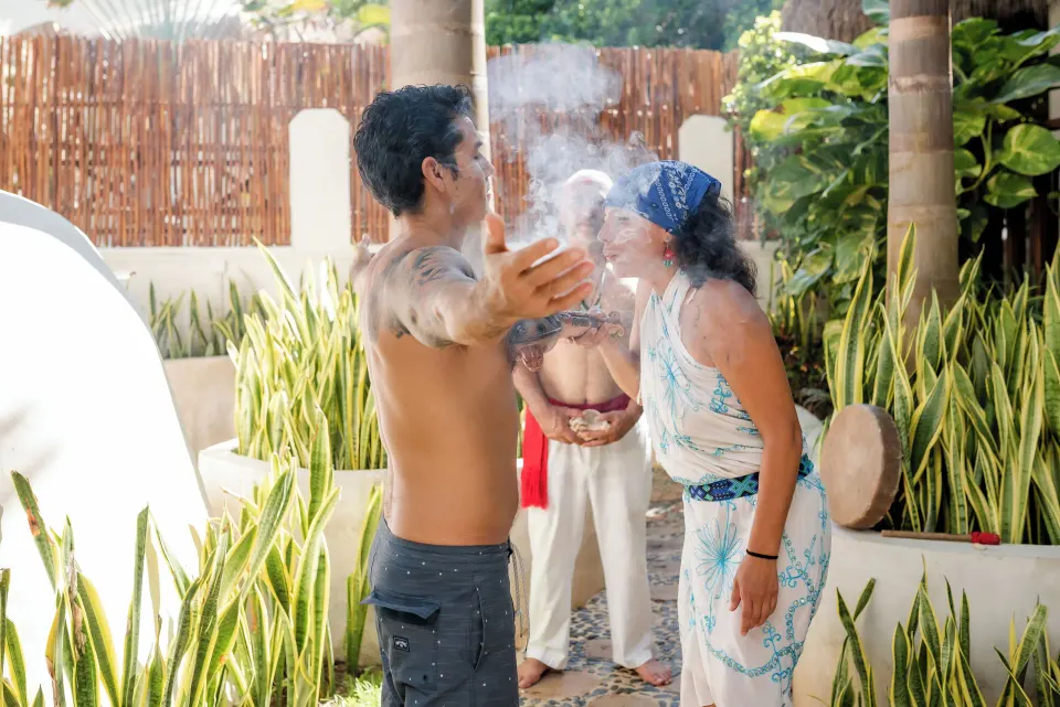 Traditional cleansing ritual performed outdoors at The Reef Playacar Beach Resort & Spa