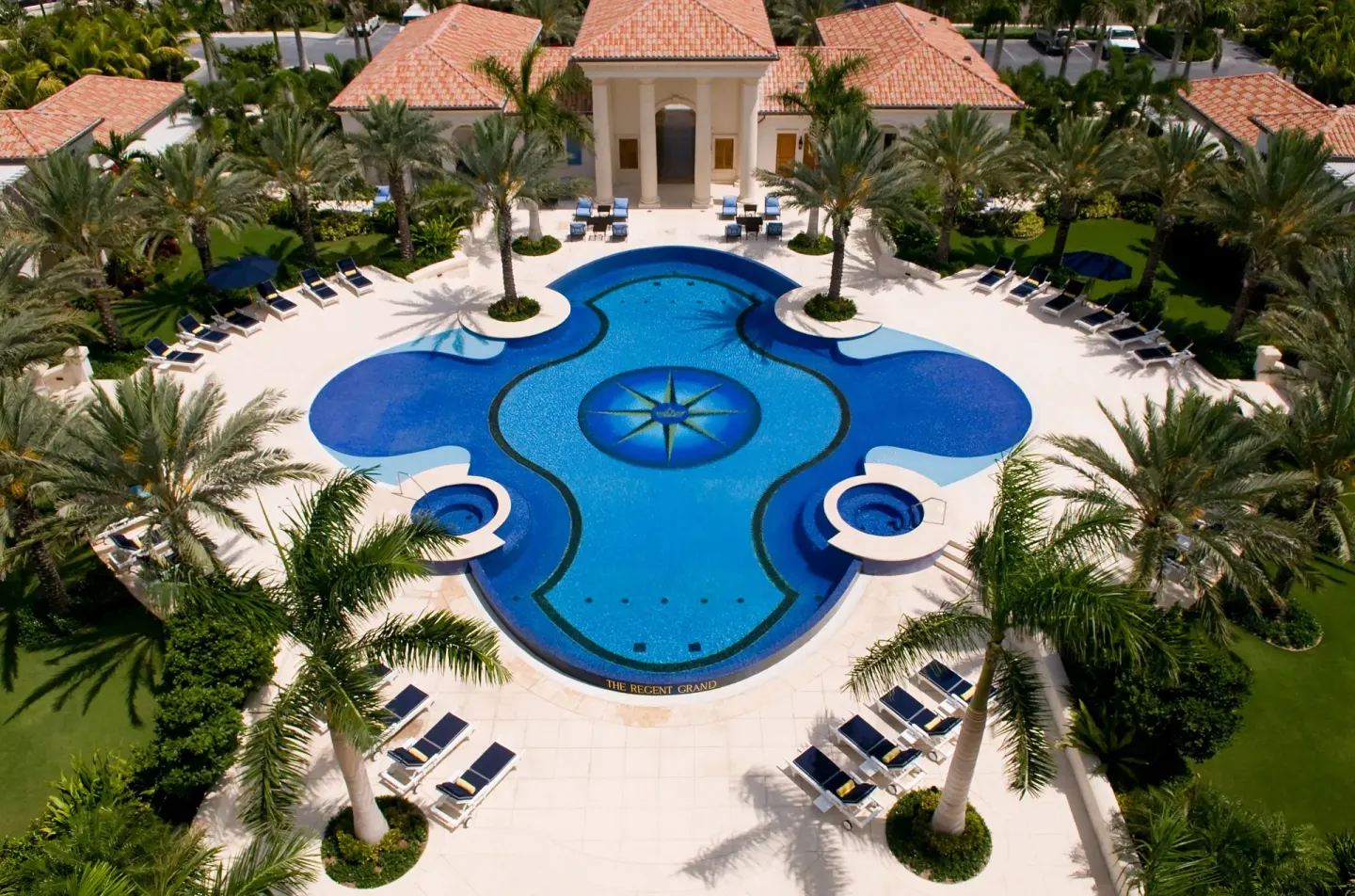 Aerial view of the resort pool and palms at The Regent Grand.