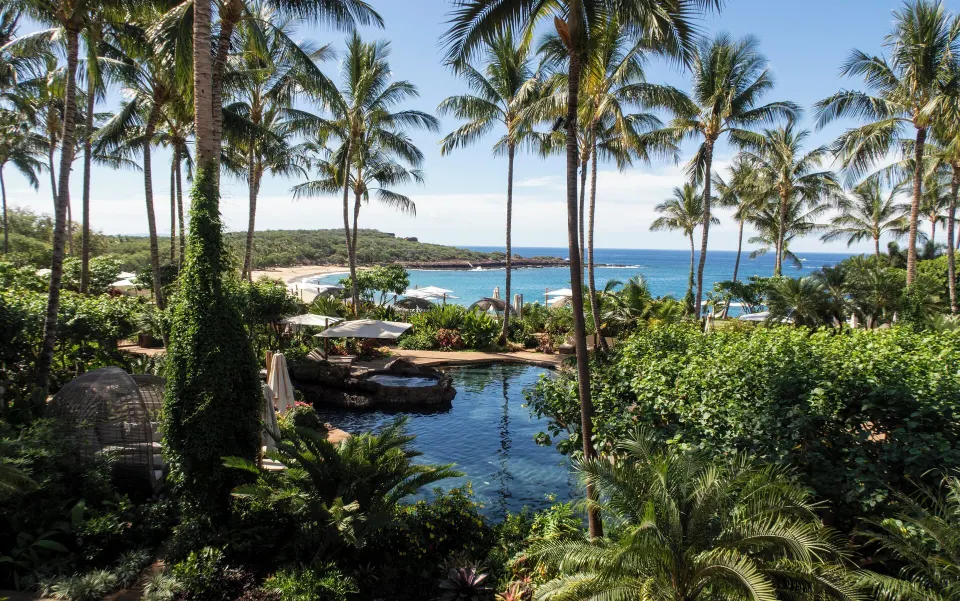 Four Seasons Resort Lanai ultra-luxury island resort with landscaped pool and oceanfront setting on Lanai, Hawaii.