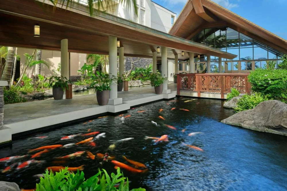 Resort entrance with covered walkway and koi pond at The Resort at Kapalua Bay, Maui