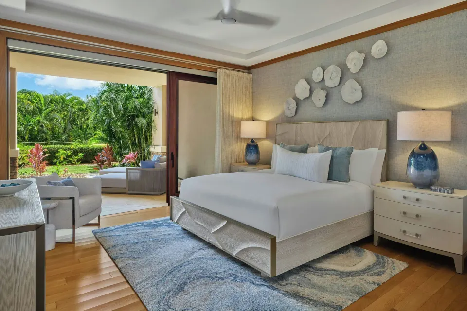 King bed and open lanai with garden view in a 3 Bedroom Residence at The Resort at Kapalua Bay, Maui