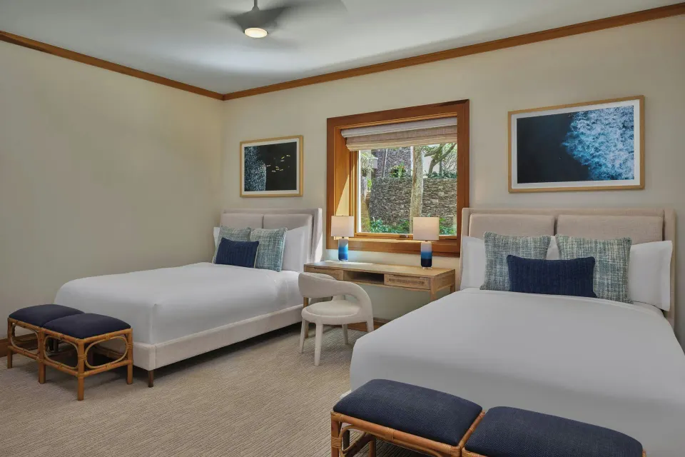 Bedroom with two beds and desk in a 3 Bedroom Residence at The Resort at Kapalua Bay, Maui