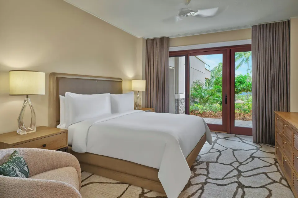 Bedroom with king bed and garden-view doors in a 3 Bedroom Residence at The Resort at Kapalua Bay, Maui