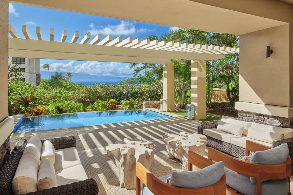 Private plunge pool and covered lanai seating at a 3 Bedroom Residence at The Resort at Kapalua Bay, Maui