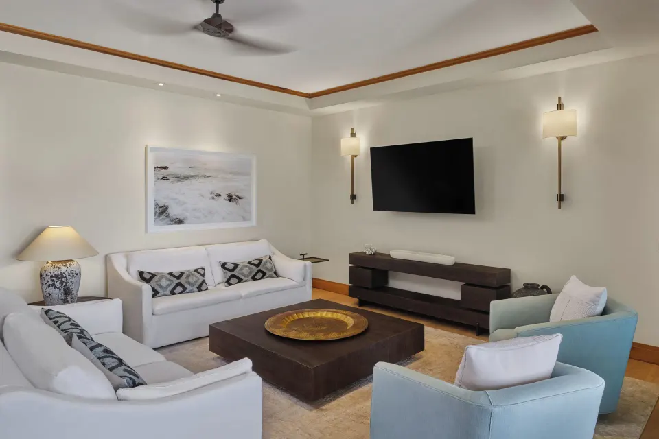 Sitting room with sofas and wall-mounted TV in a 3 Bedroom Residence at The Resort at Kapalua Bay, Maui