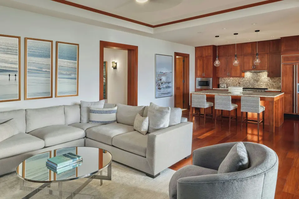 Living room and open kitchen with island and barstools at The Resort at Kapalua Bay, Maui