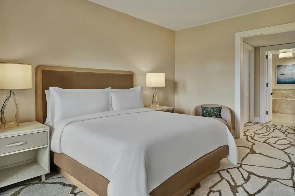 King bed and bedside lamps in a 3 Bedroom Residence at The Resort at Kapalua Bay, Maui